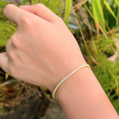 Bratara tennis din argint placata cu aur cu cristale zirconiu cesini purtata