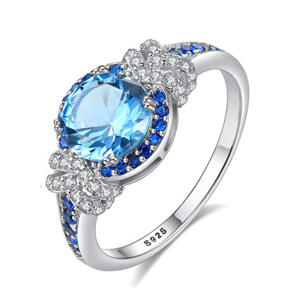 Inel din argint elegant rotund cu safir albastru si cristale zirconiu cesini