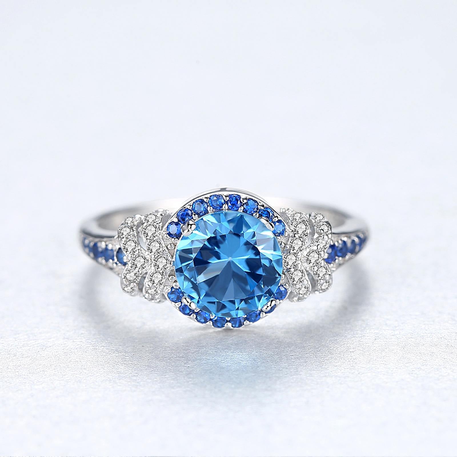 Inel din argint elegant rotund cu safir albastru si cristale zirconiu cesini cadou