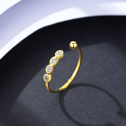 Inel din argint reglabil placat cu aur cu cristale zirconiu si biluta cesini cadou